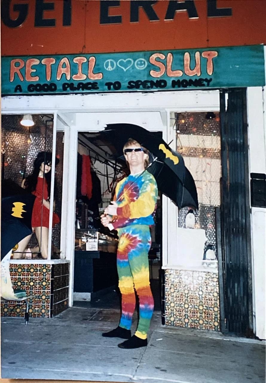 “RETAIL SLUT — A GOOD PLACE TO SPEND MONEY.” The Melrose storefront, sign and all.