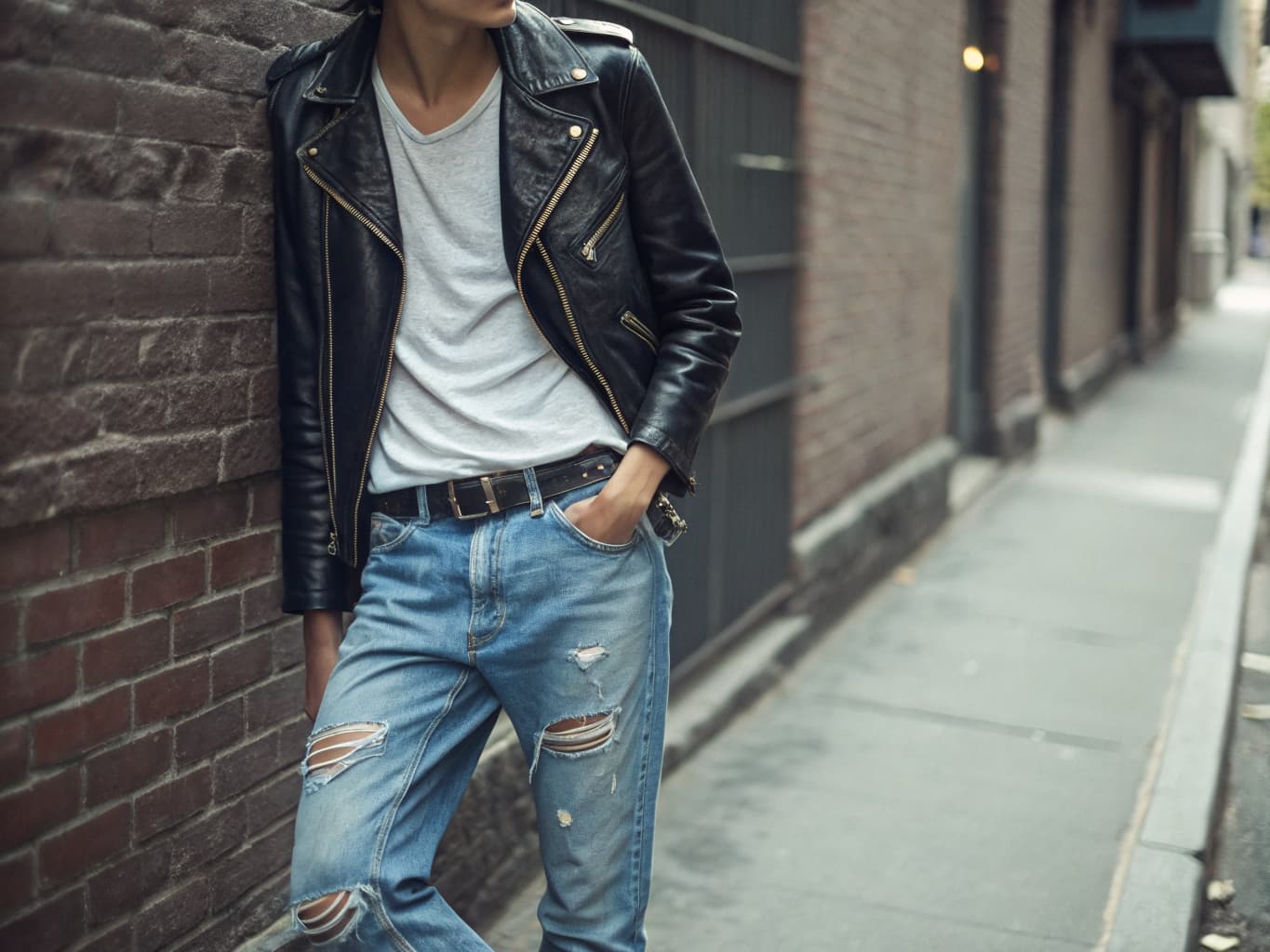 Ramones-style New York punk leather jacket and torn jeans street style