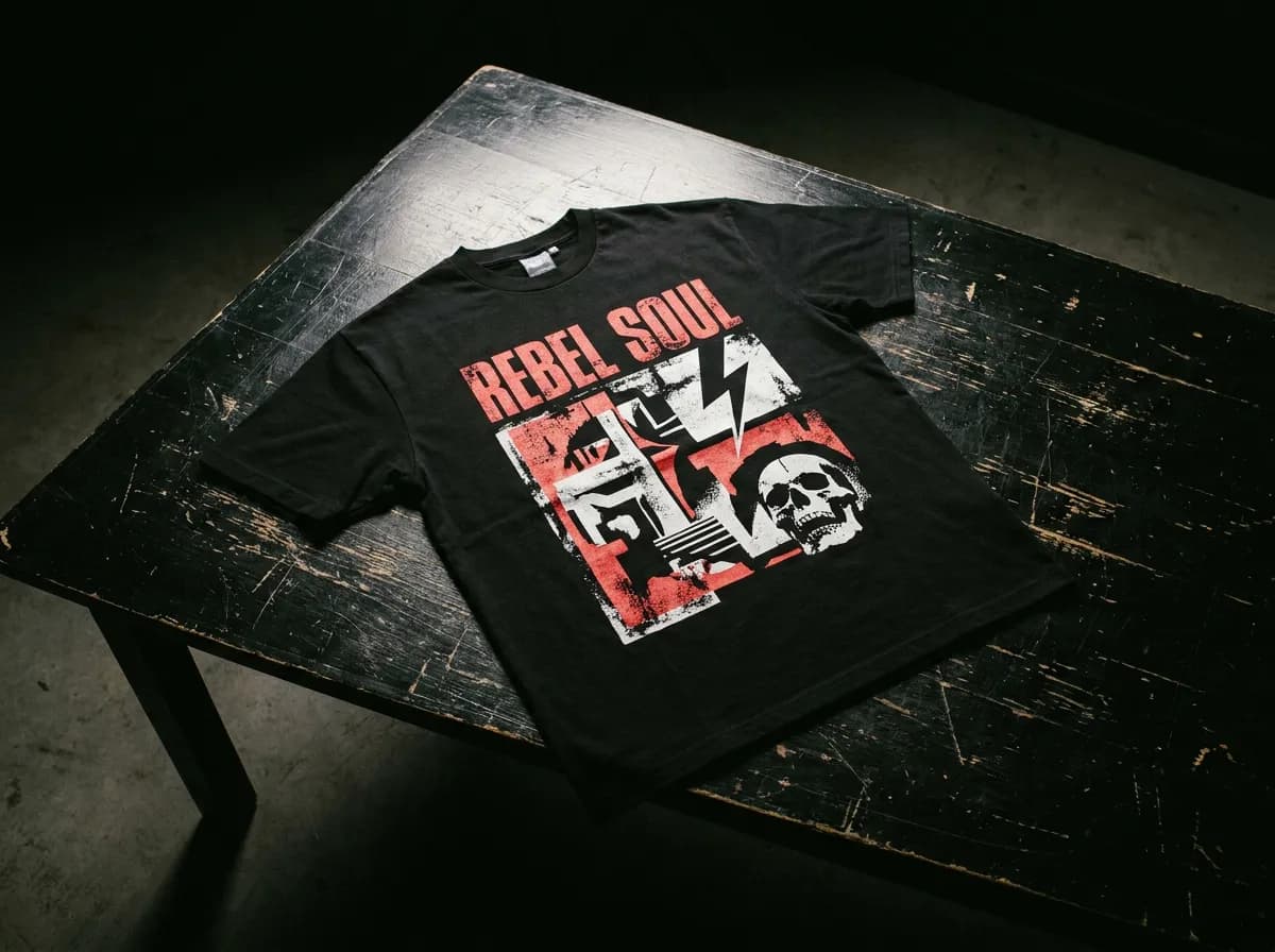 Bold graphic print t-shirt laid flat under studio light